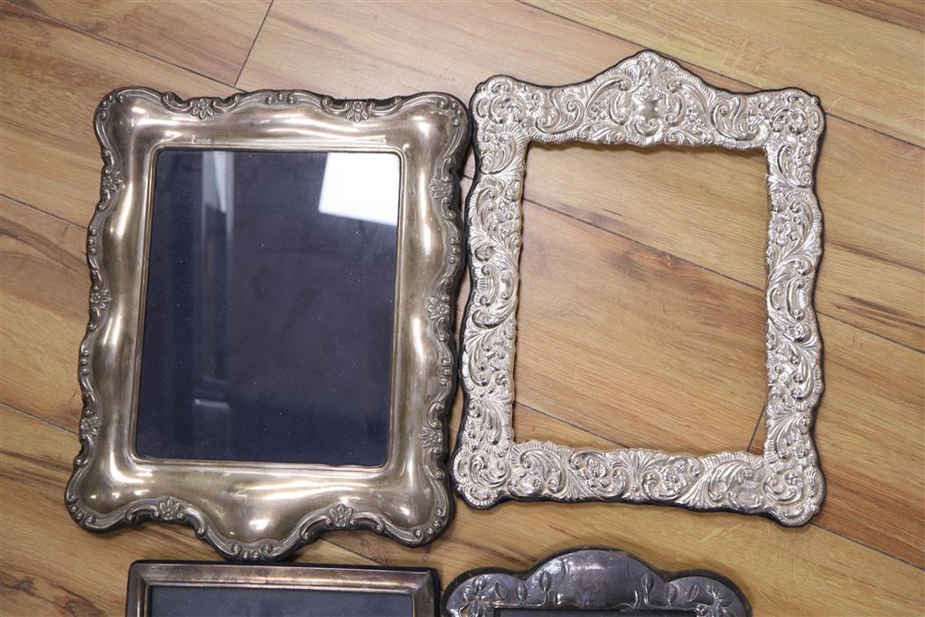 Six assorted large modern silver mounted photograph frames, largest 39cm.